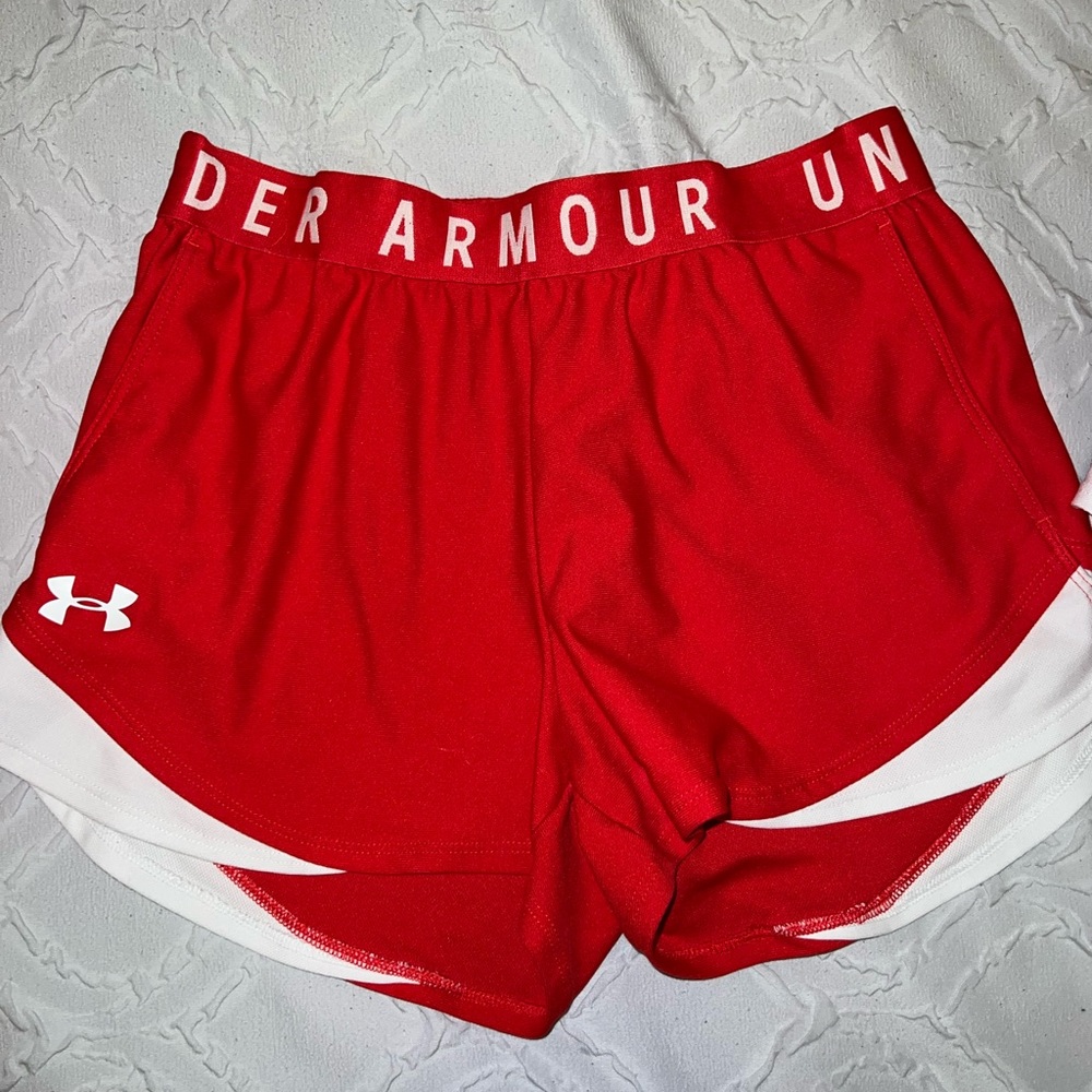 Two under armor shorts size small